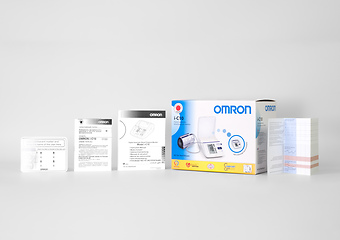Коробка и документация к автоматическому тонометру Omron i-C10