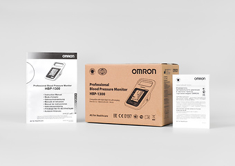 Коробка и документация к автоматическому тонометру Omron HBP-1300