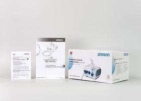 Коробка и документация к компрессорному небулайзеру Omron C 28